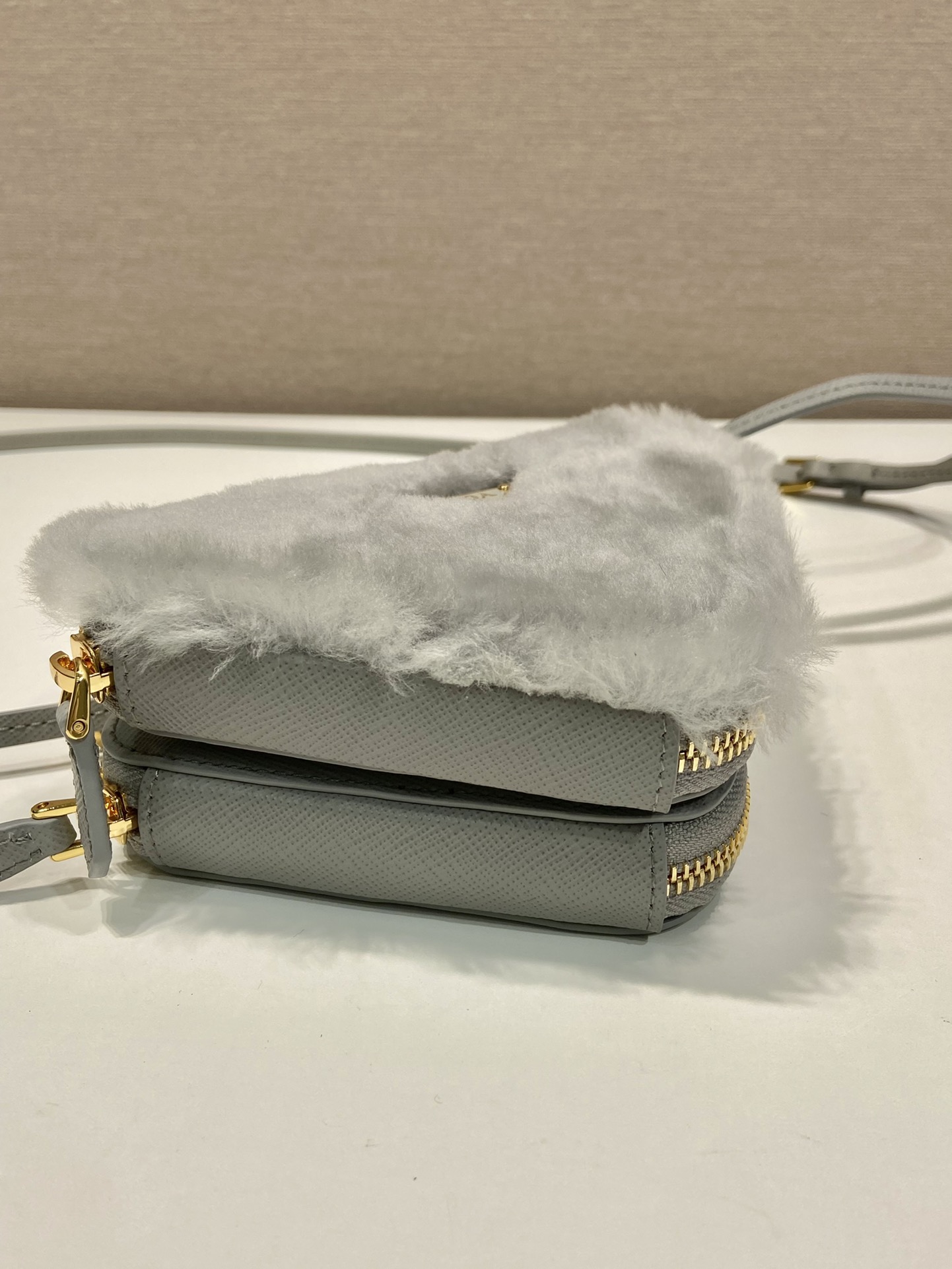 Pra*a shearling and saffiano leather mini-pouch
