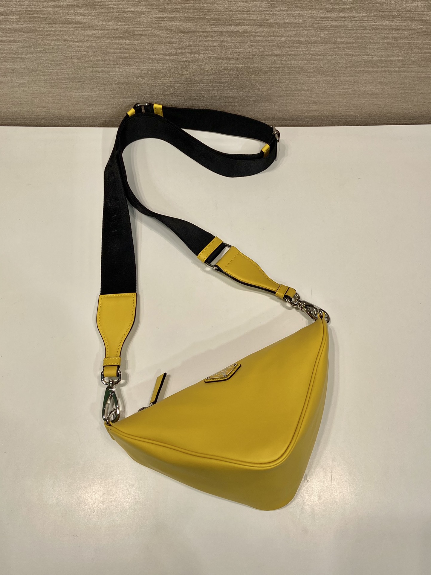 saffiano Pra*a triangle bag