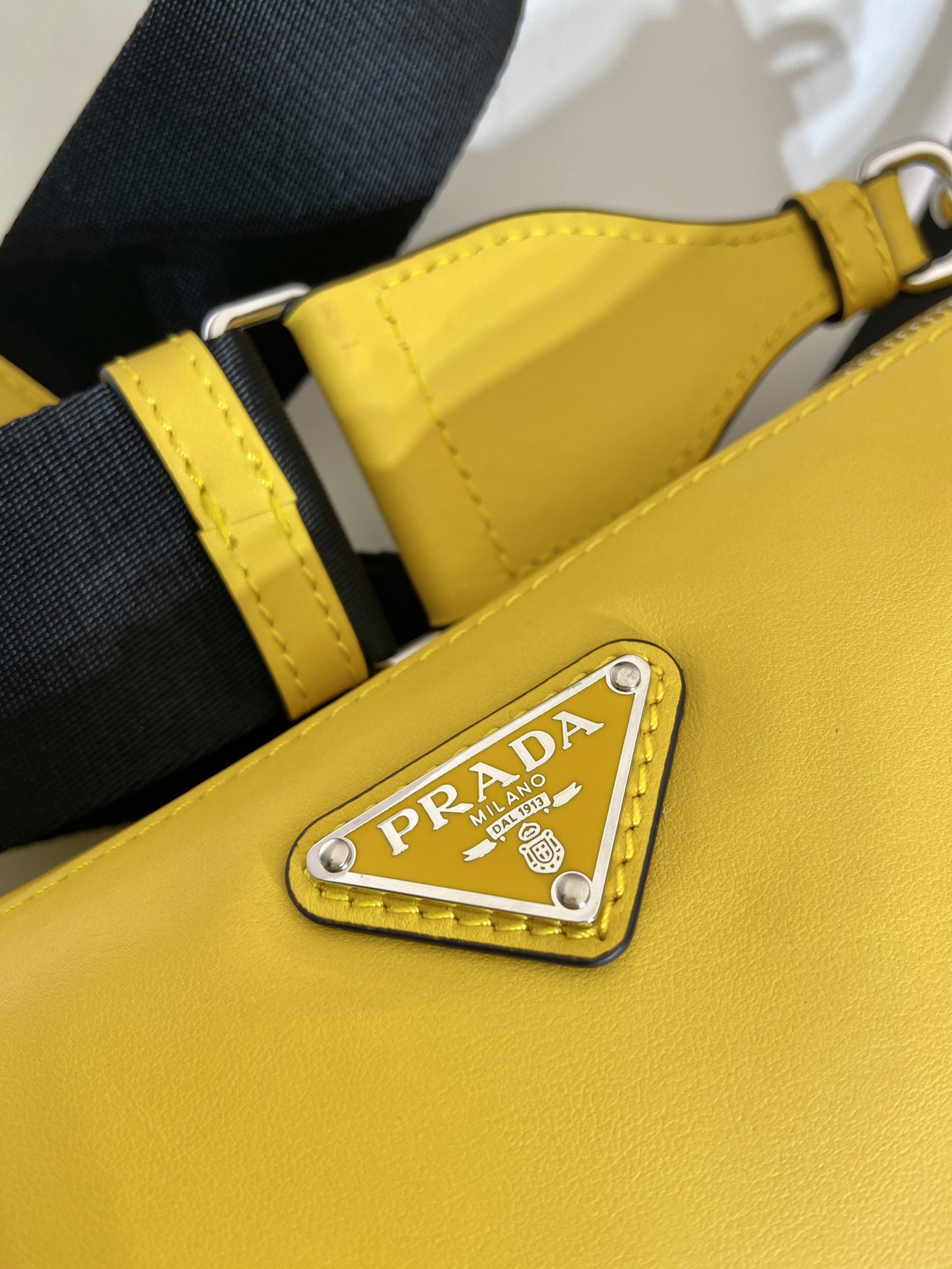 saffiano Pra*a triangle bag
