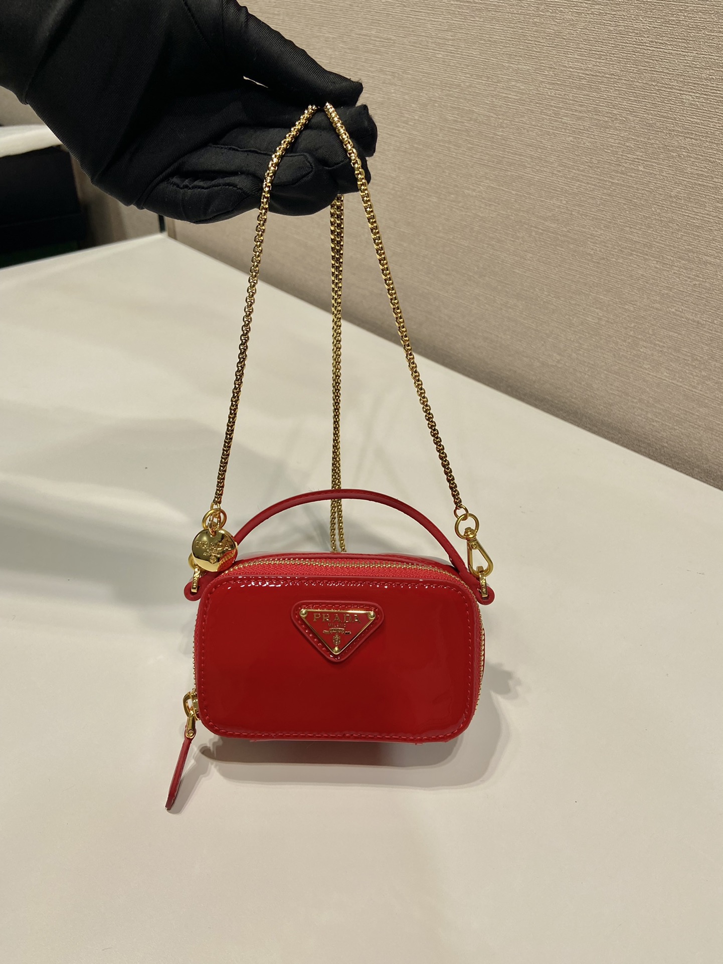 Pra*a patent leather mini-pouch