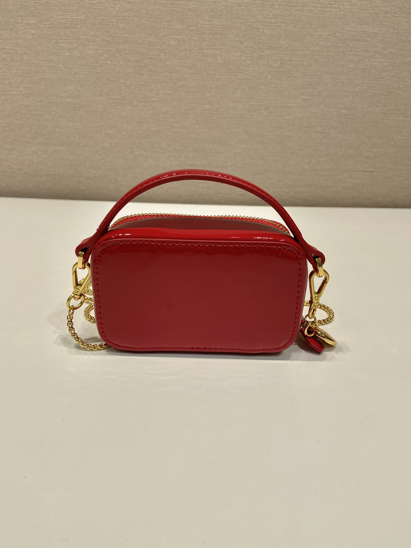Pra*a patent leather mini-pouch