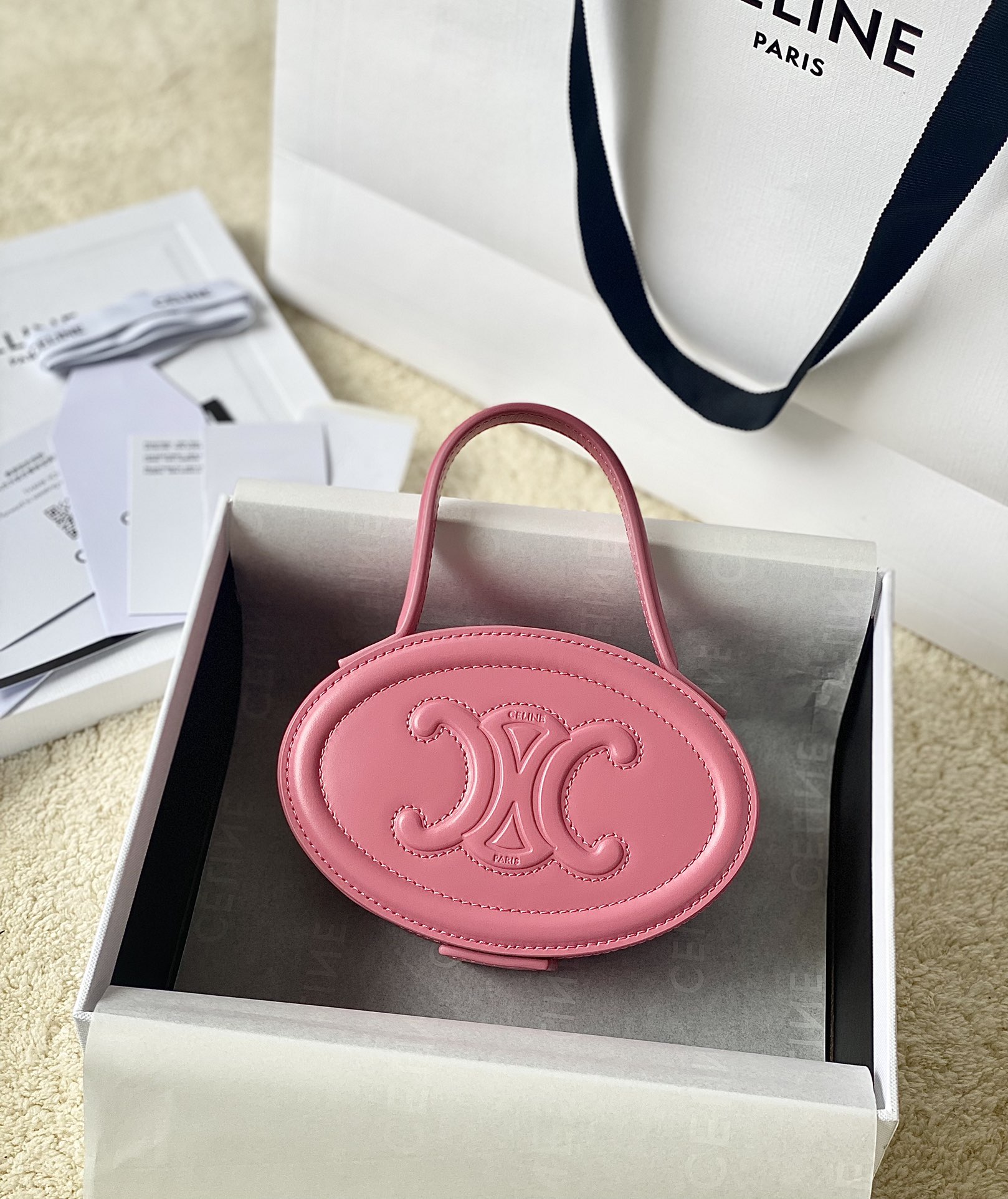Ce**e oval minaudiere cuir triomphe
