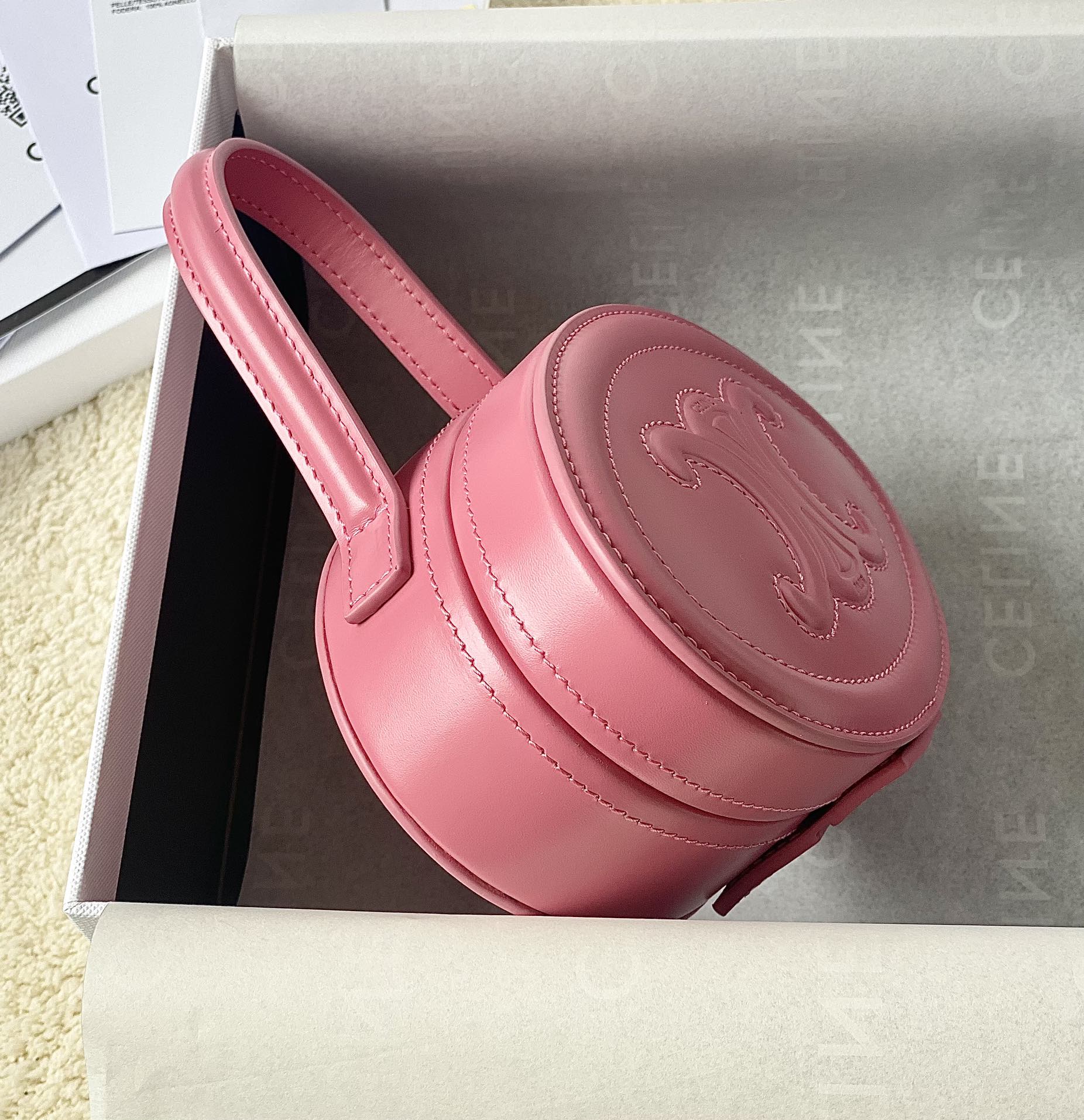 Ce**e oval minaudiere cuir triomphe